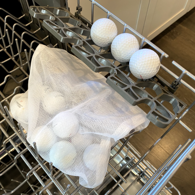 Sports equipment on the top rack of a dishwasher
