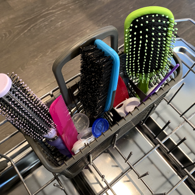 Grooming tools in the utensil holder of a dishwasher