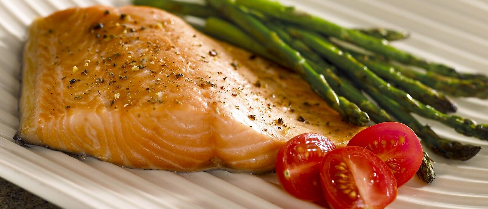 Close up of cooked salmon and vegetables