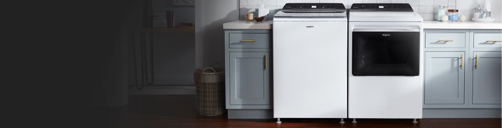 White Whirlpool® Top Load Washer & Dryer next to cabinets