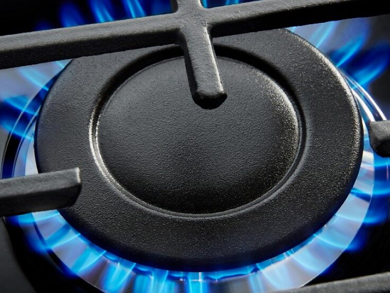 Close up image of a gas cooktop burner
