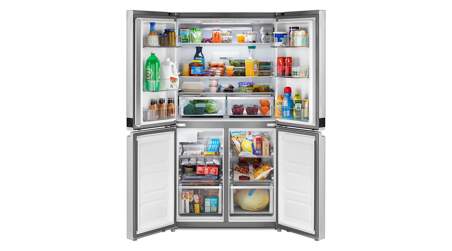 Four door refrigerator opened to show contents