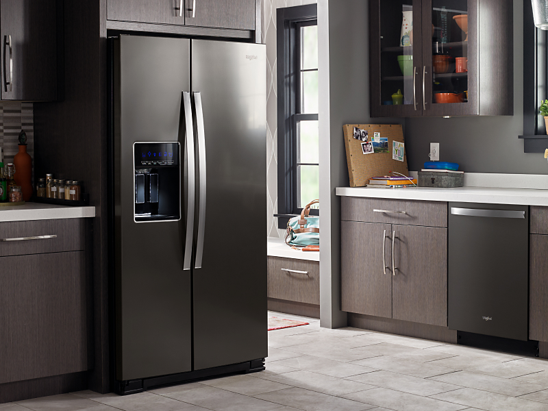 Modern kitchen with brown cabinets and Whirlpool® refrigerator and dishwasher