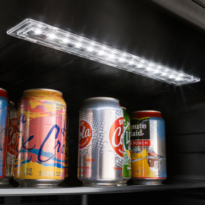 Interior light from beverage center shining on soda cans