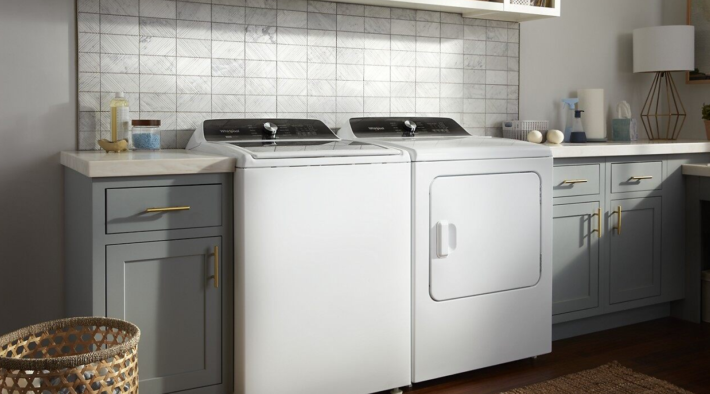  A Whirlpool® washer and dryer pair in a laundry room