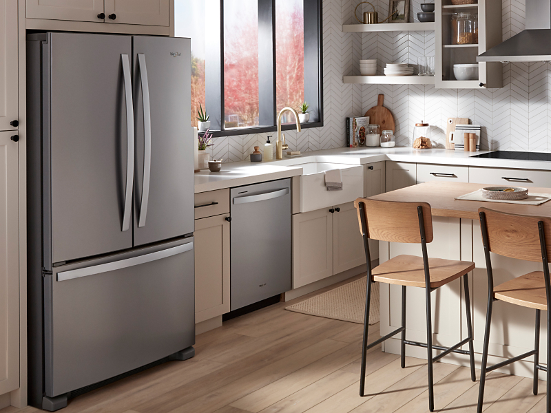 Stainless steel Whirlpool® appliances in an open concept kitchen