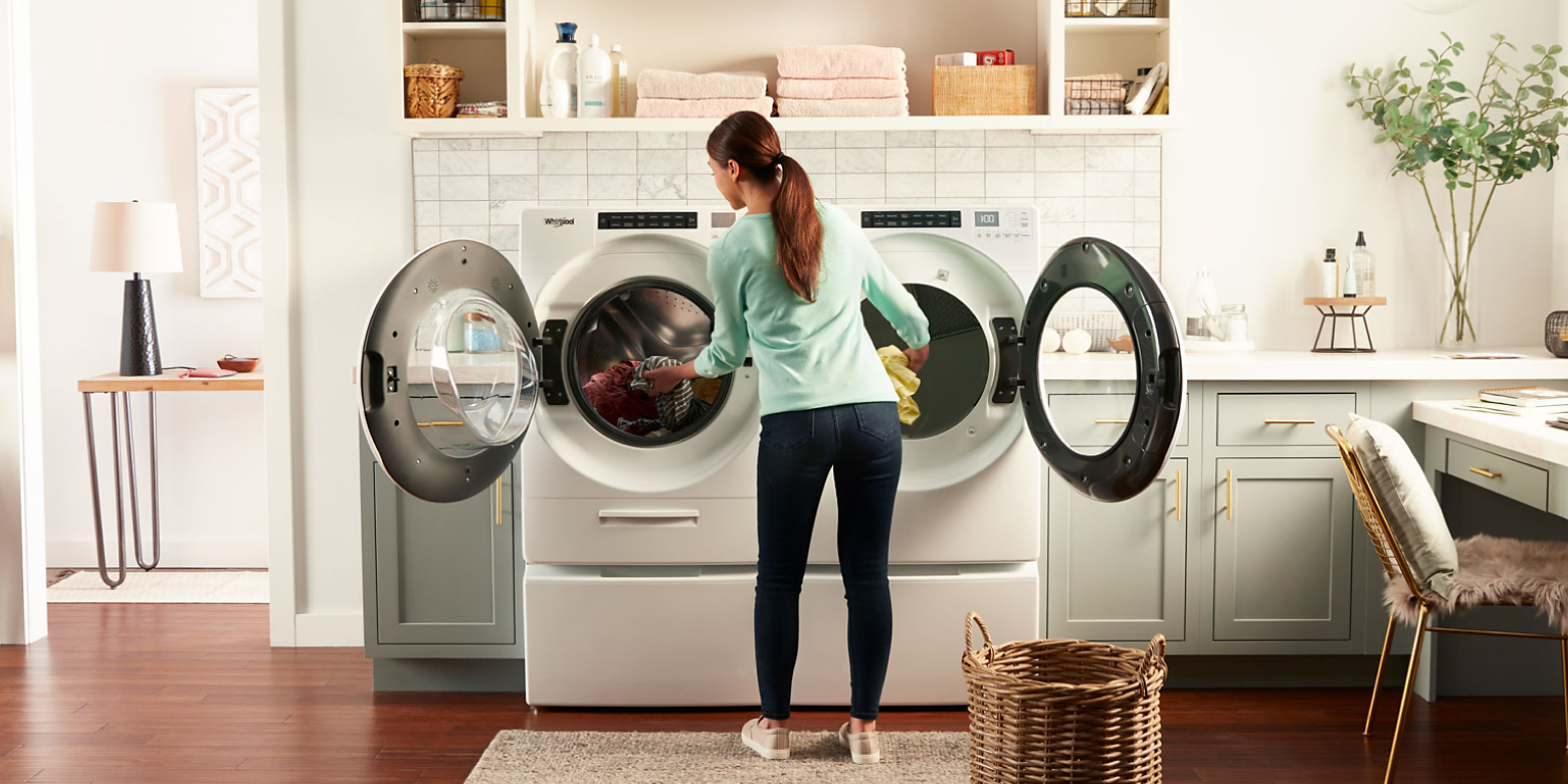 An image of a woman loading laundry