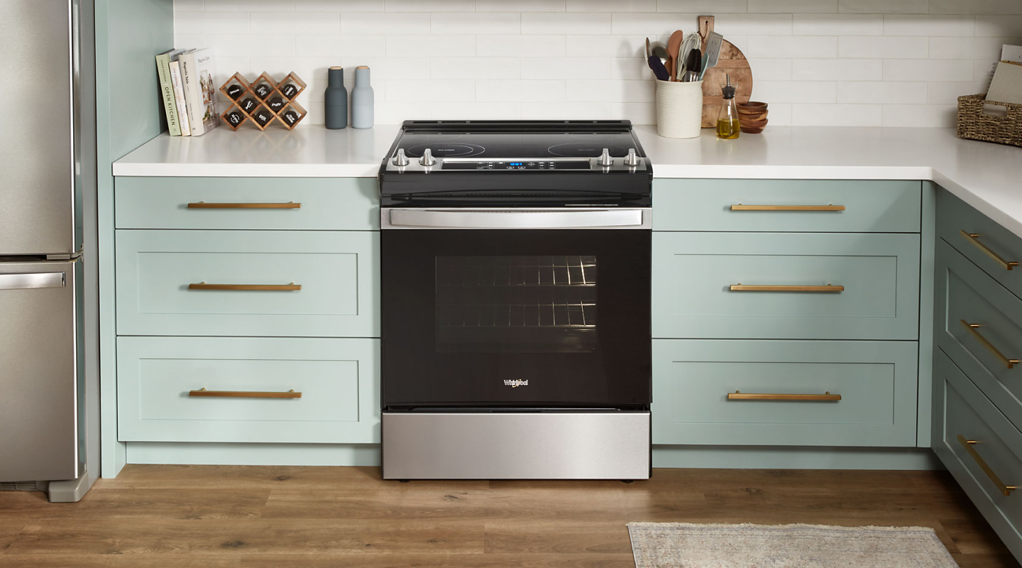 Whirlpool® electric range in a light blue kitchen