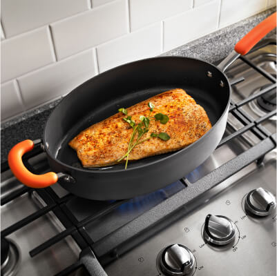 Food cooking in a pan on a stovetop