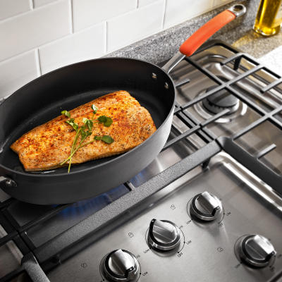 Food cooking in a pan on a stovetop