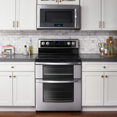 Double oven set in white cabinetry