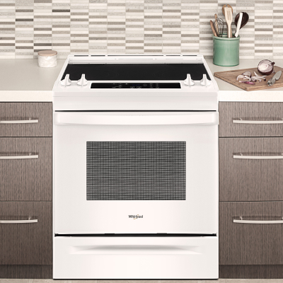White Whirlpool® range set in cabinetry