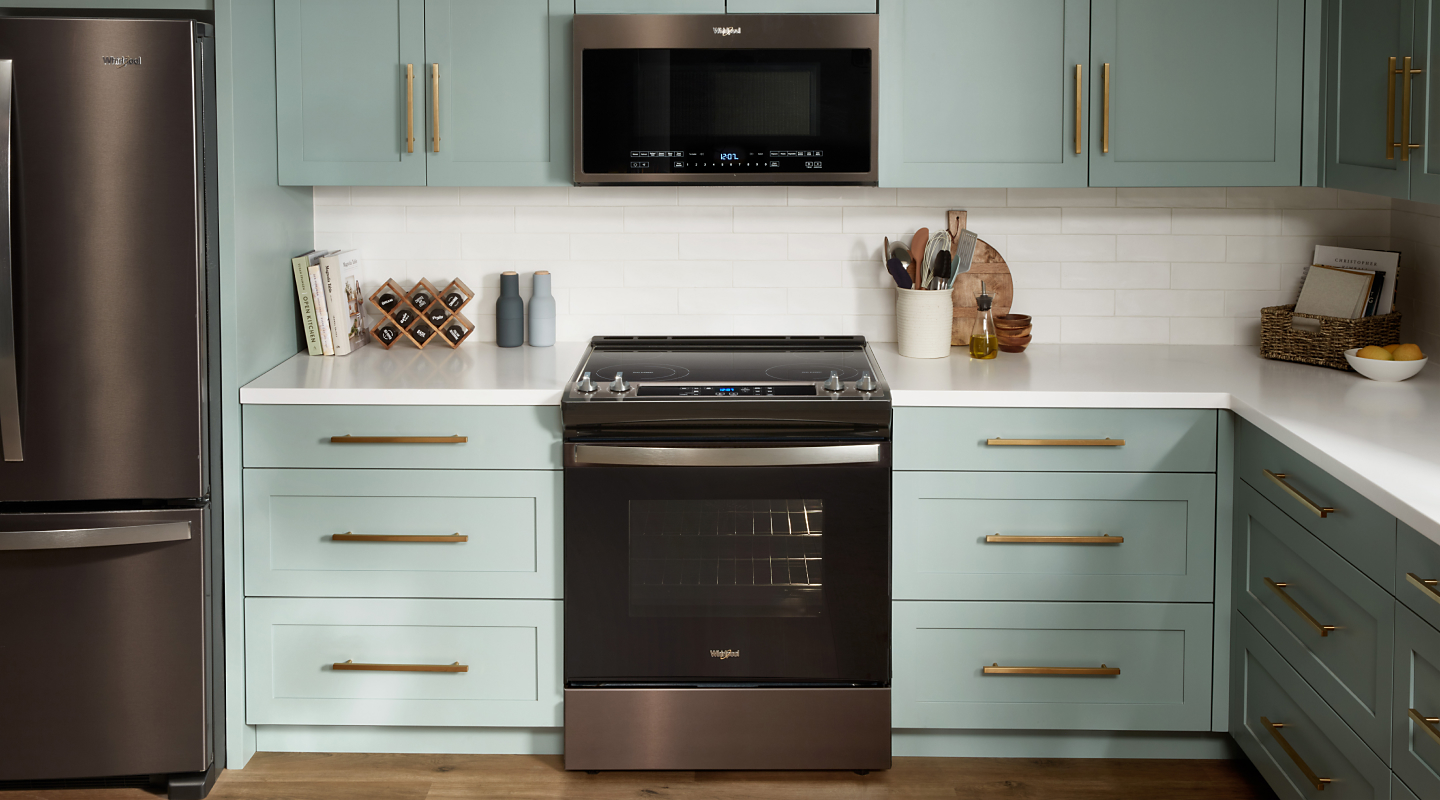 Whirlpool® range set in light green cabinetry Whirlpool® range set in light green cabinetry