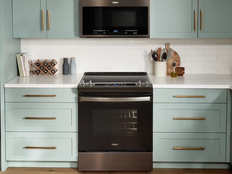 Whirlpool® range set in light green cabinetry Whirlpool® range set in light green cabinetry