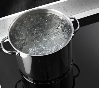 A boiling pot of water on a Whirlpool® Induction Cooktop