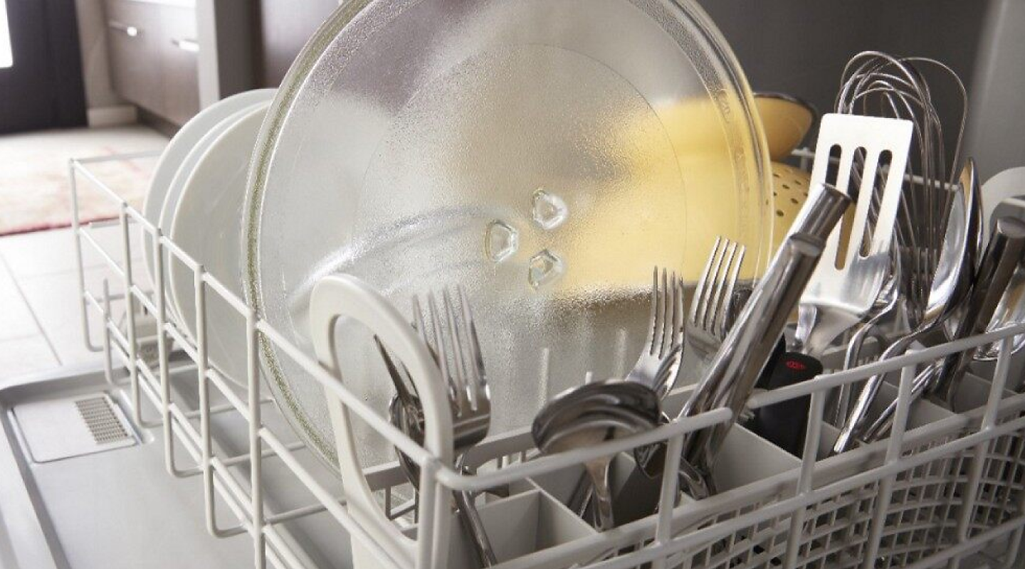 Dishes loaded in the lower rack of a dishwasher