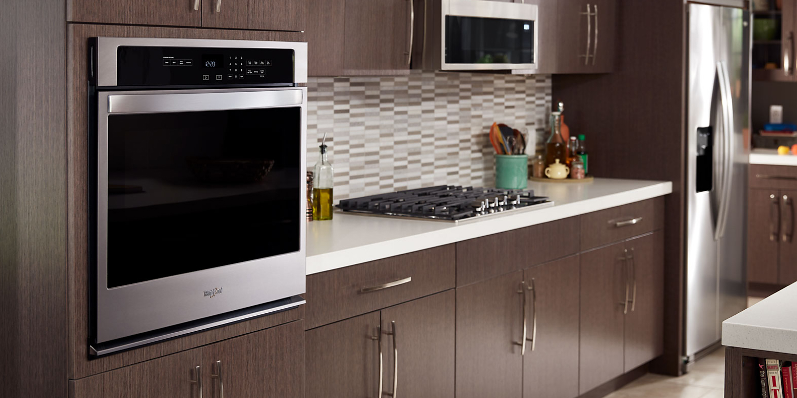 A Whirlpool® stainless steel wall oven in a modern kitchen