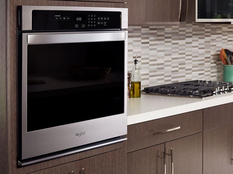 A Whirlpool® stainless steel wall oven in a modern kitchen