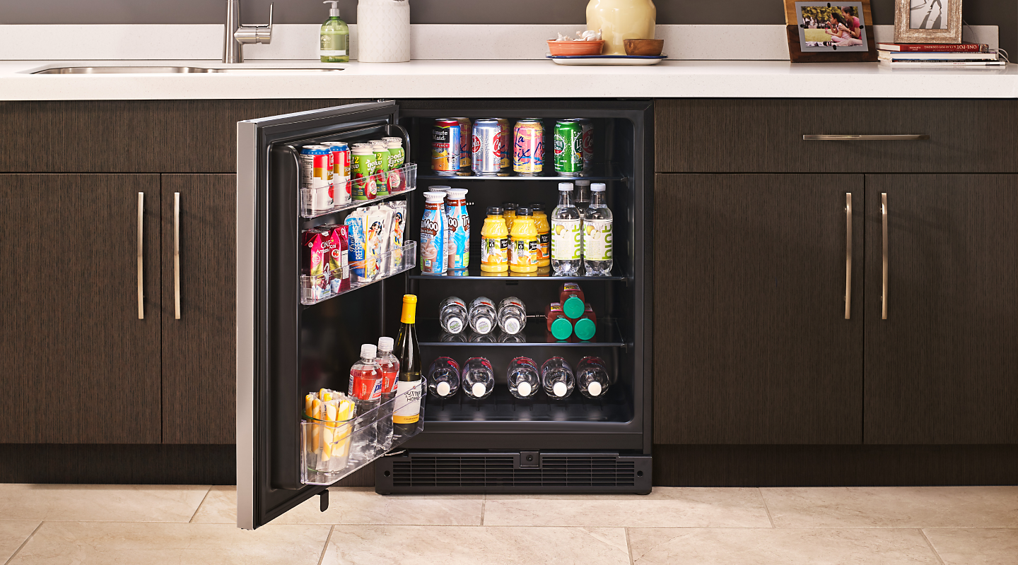 A Whirlpool® wine refrigerator with various beverages inside