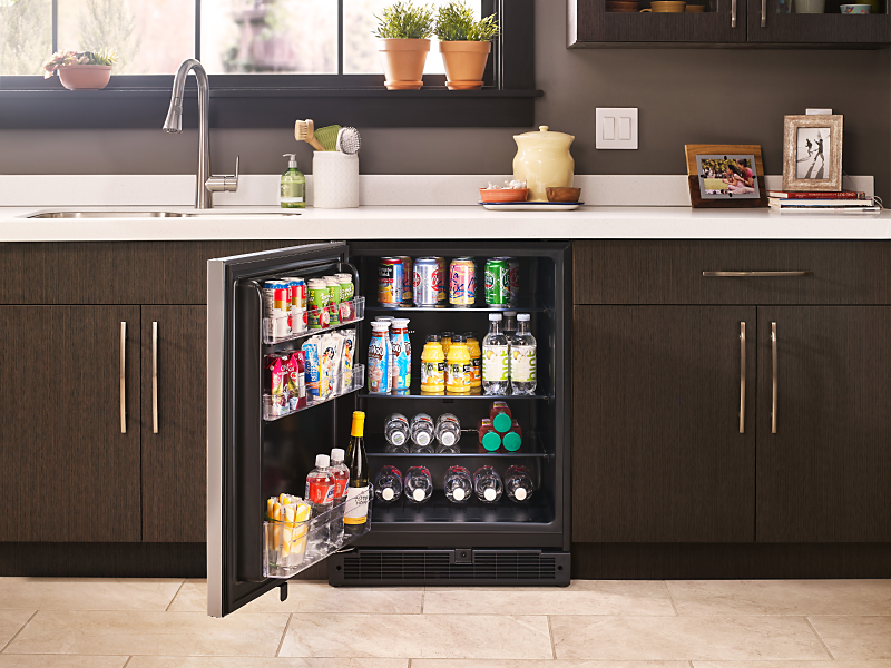 A Whirlpool® wine refrigerator with various beverages inside