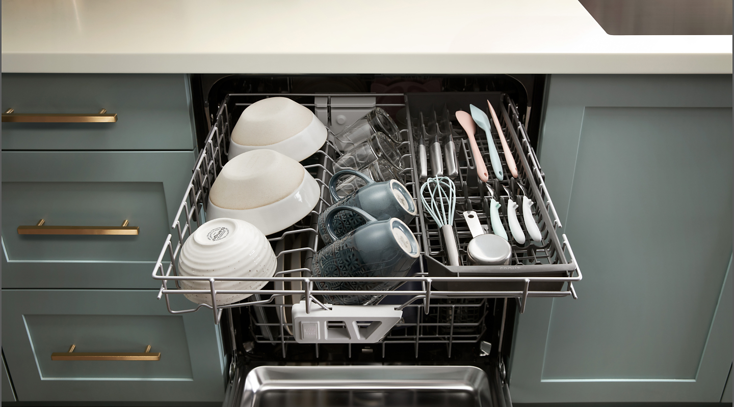 A dishwasher third rack loaded with cups and bowls
