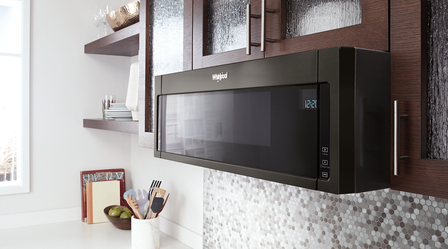 A Whirlpool® Over-The-Range Microwave in a modern kitchen. 