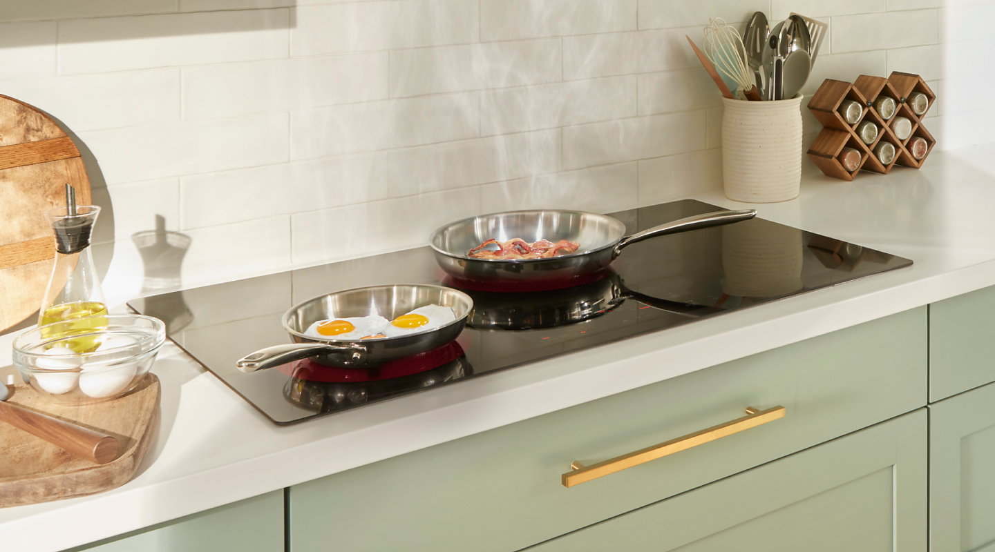 Pans with food in them on Whirlpool® cooktop