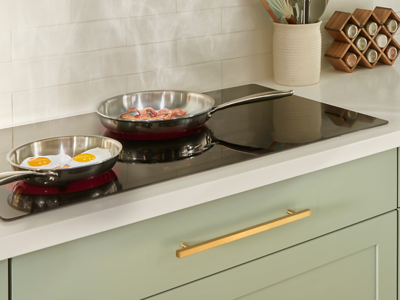 Pans with food in them on Whirlpool® cooktop
