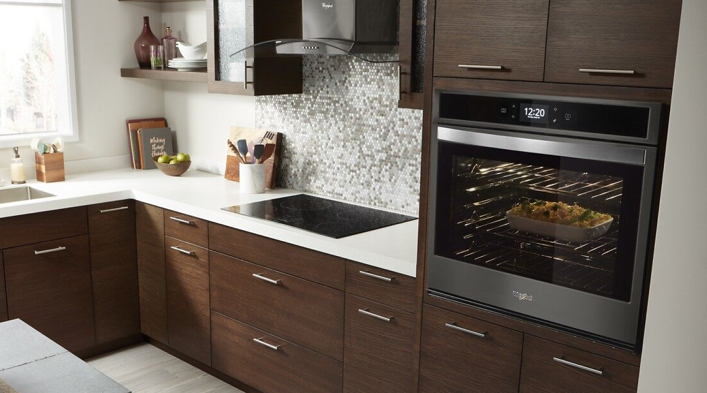 Fingerprint Resistant Black Stainless Whirlpool® Smart Oven in wood cabinetry
