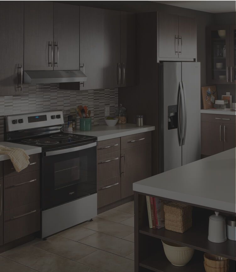 Whirlpool® kitchen suite featuring a range, side-by-side refrigerator and front-control dishwasher.